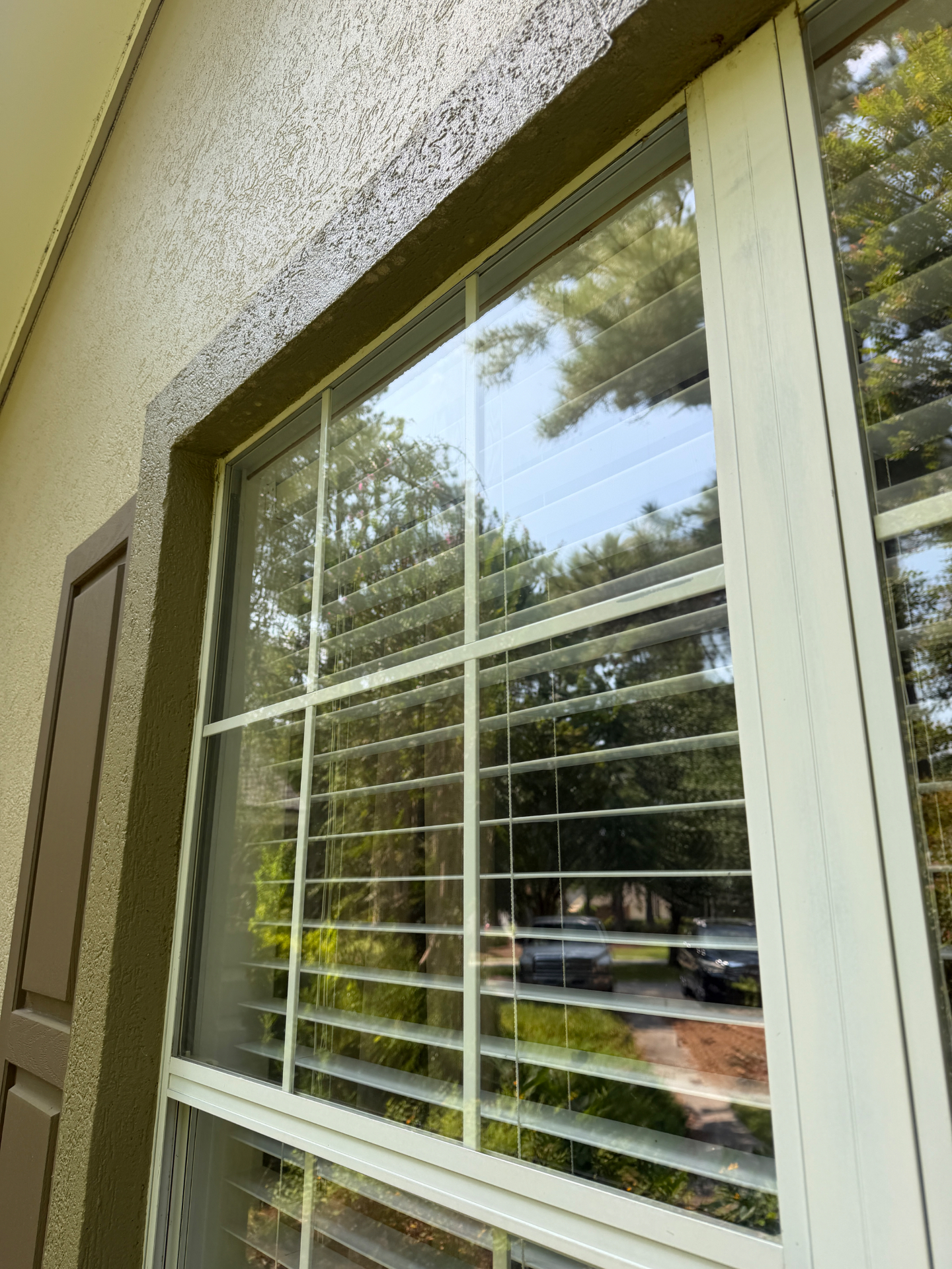 Stucco-frame picture window after — window cleaning in Valdosta, GA