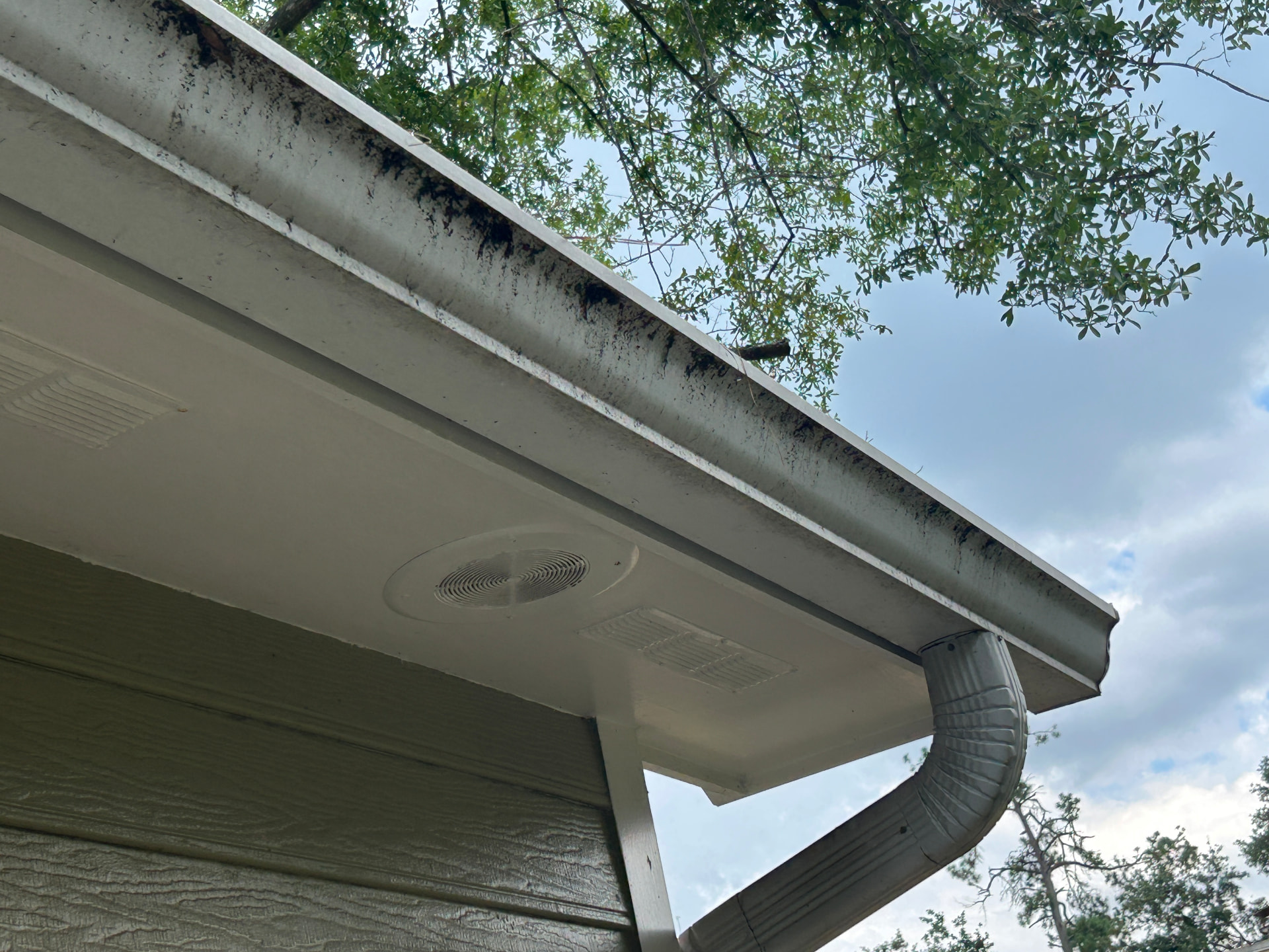 Side eave & soffit before — gutter cleaning in Valdosta, GA