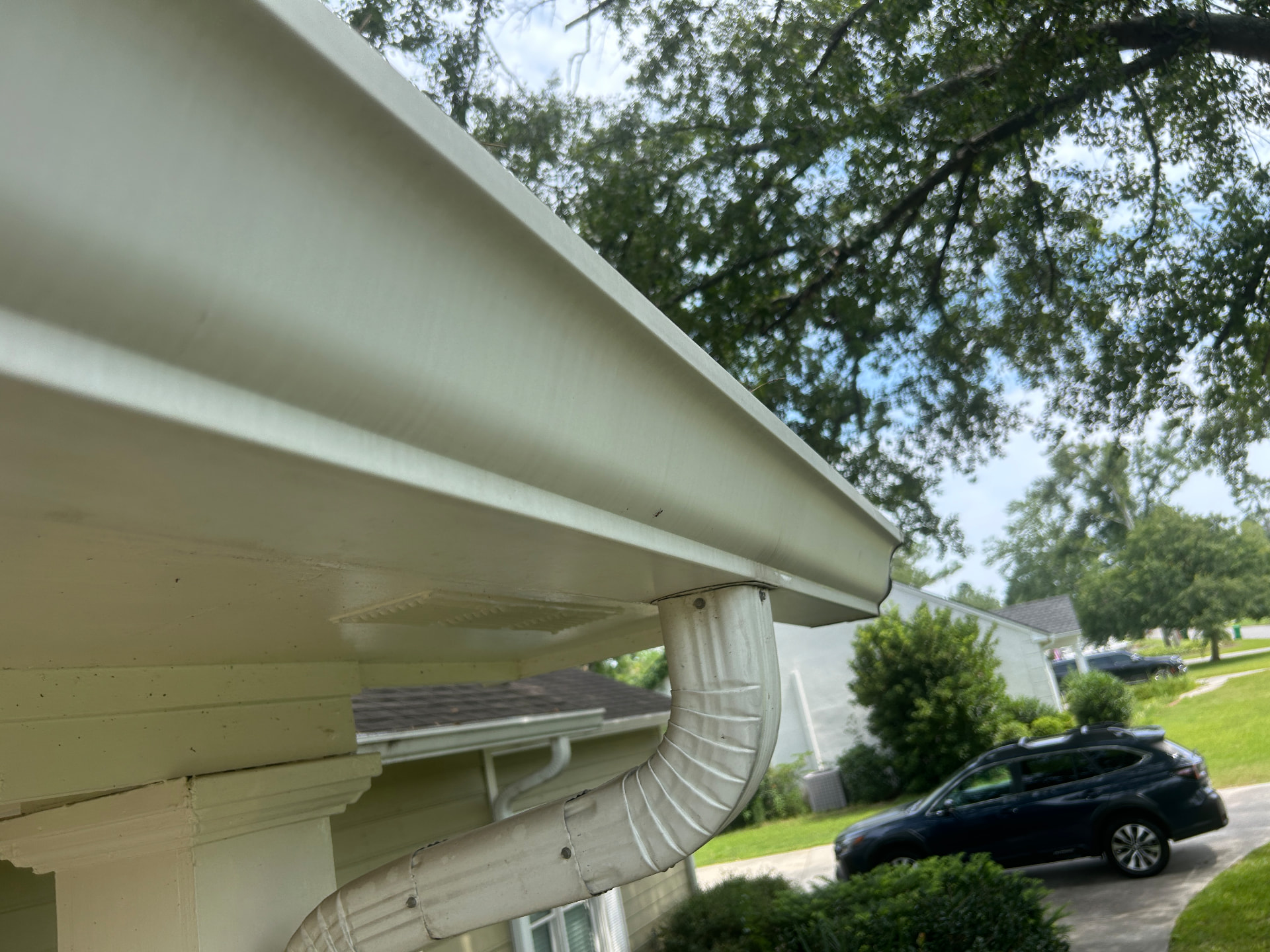 Front roofline & downspout after — gutter cleaning in Valdosta, GA